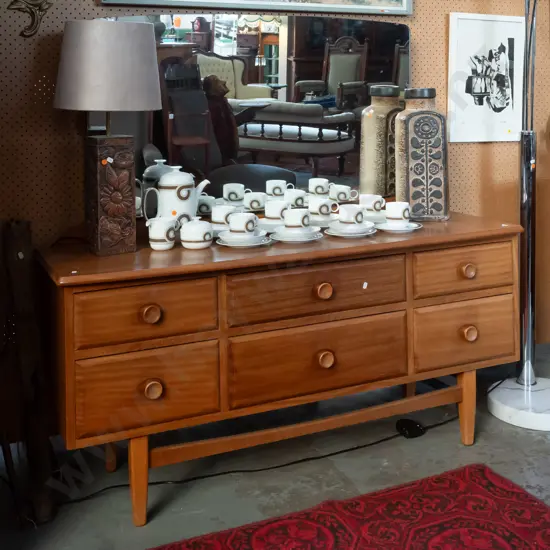 mid-century mahogany low 6-drawer mirror-back dresser with inset wooden knobs, stretcher base, with Nee's