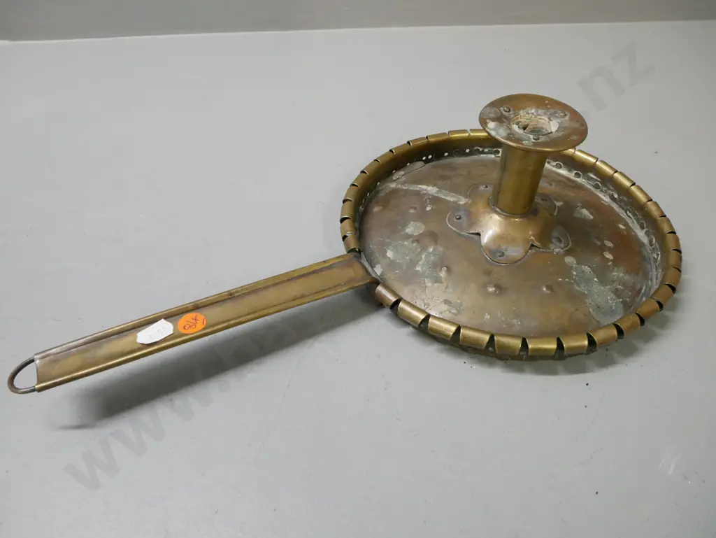 vintage brass folk art chamber stick. Some wax residue. Some dinting to candle-holder. H-100 L-400 Image 1++