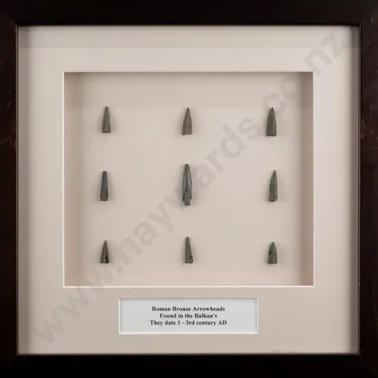 framed group of 9 Roman bronze arrowheads H-290 W-290