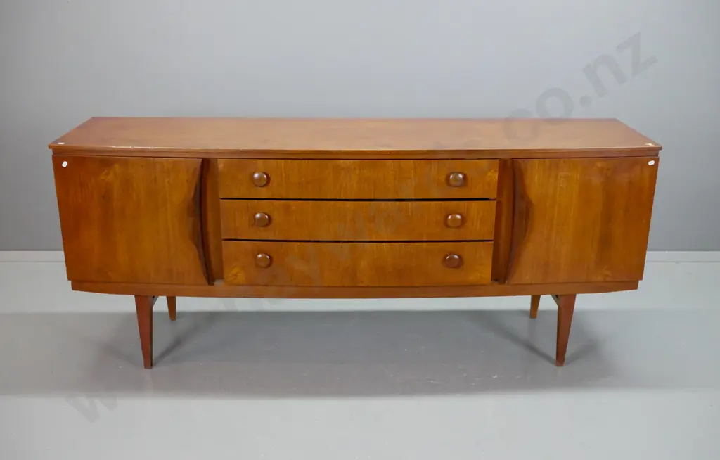 Scandinavian style teak bow-front sideboard with 2 cupboard doors, 3 drawers, wooden knobs, top drawer with lined Image 1++