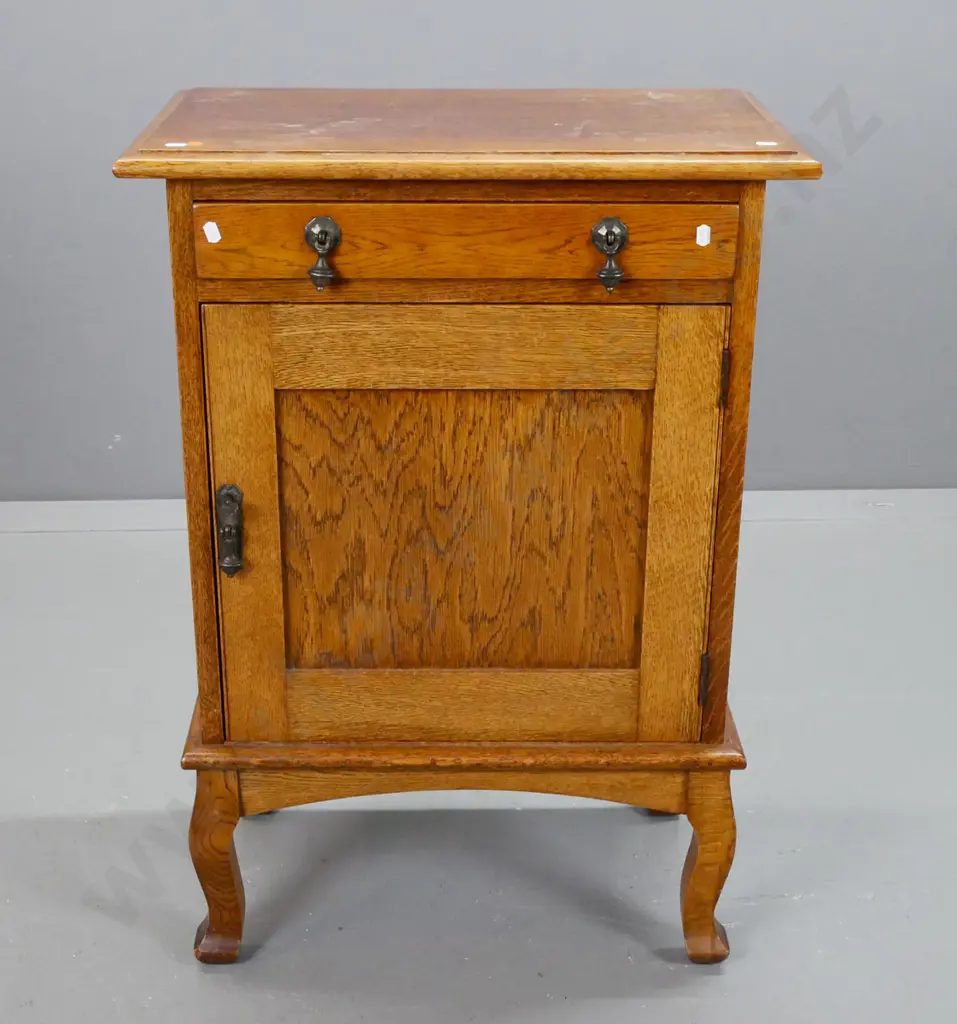 vintage oak cab leg bedside cupboard with 1 drawer, 1 door, one interior shelf, metal drop handles. Marks on top, borer Image 1++