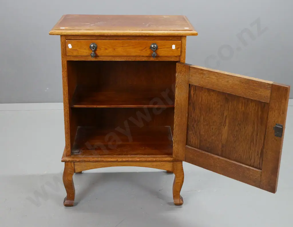 vintage oak cab leg bedside cupboard with 1 drawer, 1 door, one interior shelf, metal drop handles. Marks on top, borer Image 1++