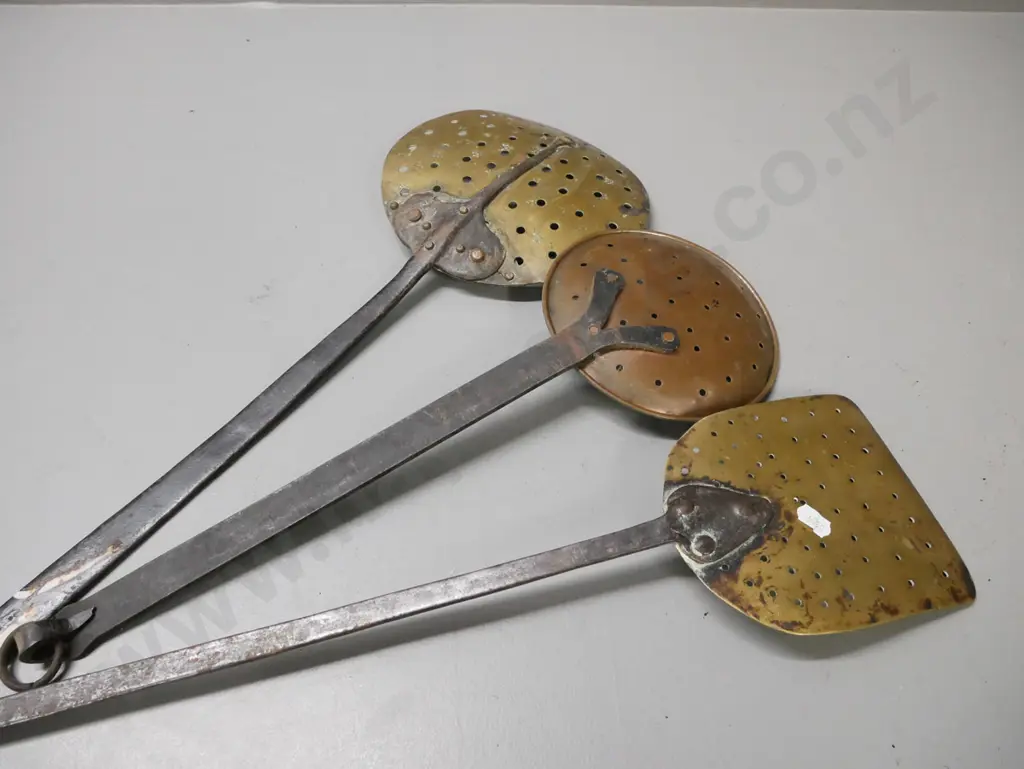 3x vintage straining utensils. Wrought iron handles, 2x brass dishes and 1x coppered white metal. Some corrosion & wear Image 1++