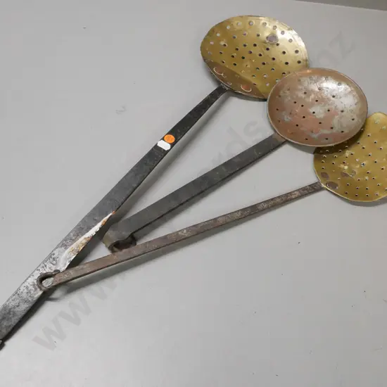 3x vintage straining utensils. Wrought iron handles, 2x brass dishes and 1x coppered white metal. Some corrosion & wear