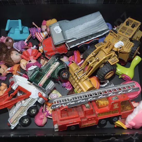 box of toy vehicles, small dolls