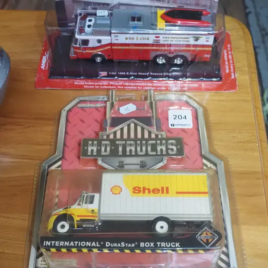 2 carded model vehicles - fire truck and Shell truck
