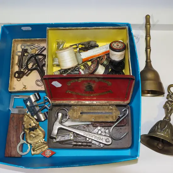 box of brass bells, watch & clock keys, spring scales, sewing machine attachments, etc.