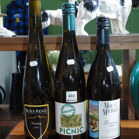 2x bottles of reisling, 1x bottle of chardonnay