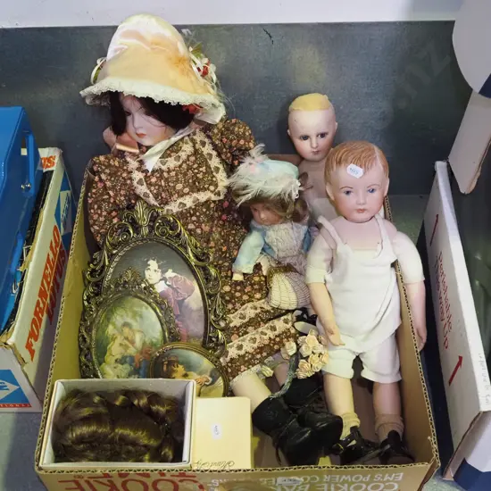 box; ornate framed prints on silk, dolls, wigs