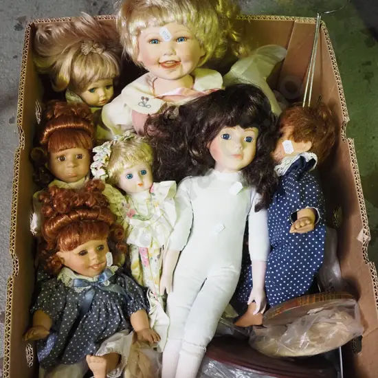 box of various display dolls