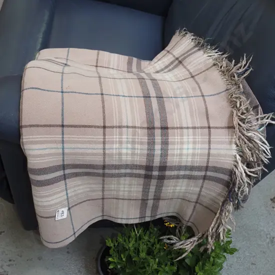 checked woollen travel rug - some wear