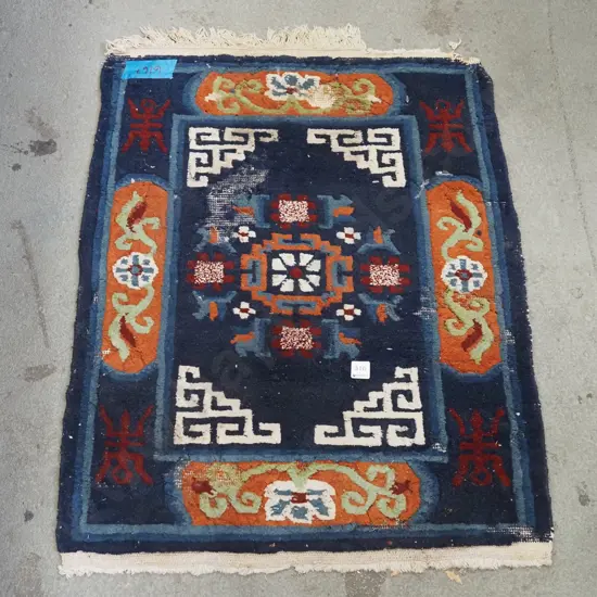 small woollen floor mat - significant wear