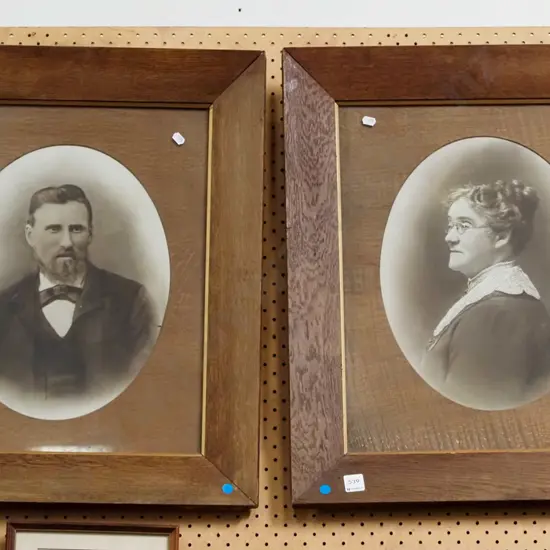 2x oak framed photo portraits