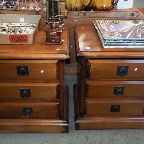pair of pine 3 drawer bedside cabinets with drop metal  handles