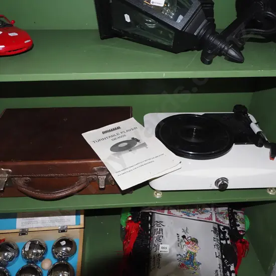 small leather suitcase and a Digitech turntable