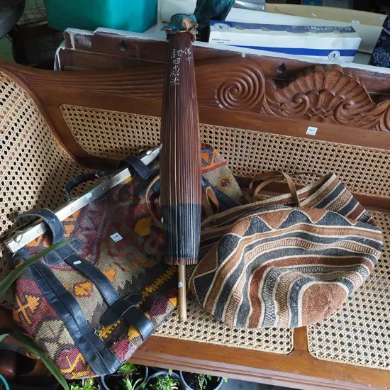 carpet bag, jute handbag and a parasol