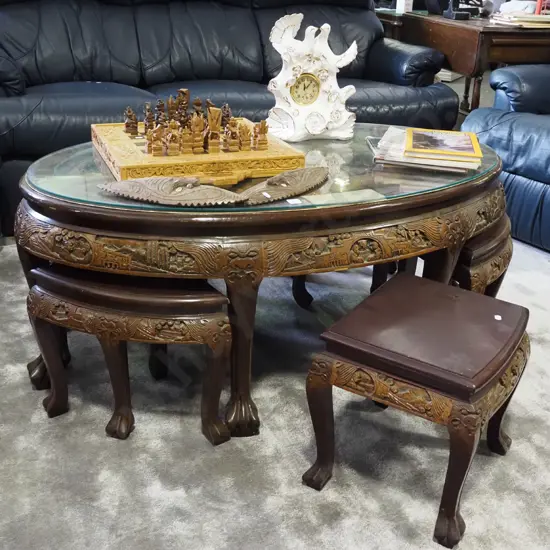 heavily carved Chinese oval low dining table with 6 matching stools H-520 W-1250 D-750