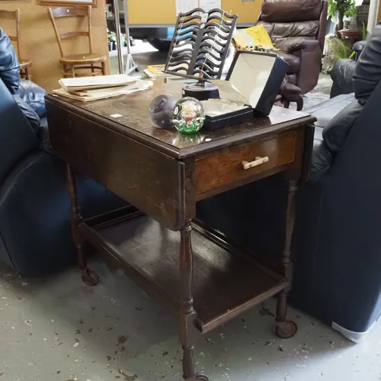 oak drop side tea trolley on casters - varnish needs attention