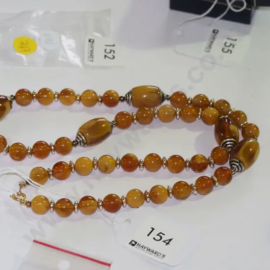 strand of pressed amber 60cm 9.6/9.8 round beads with 5 x16mm tube beads