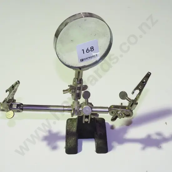very dusty fly fishing magnifying  glass and fly tieing stand