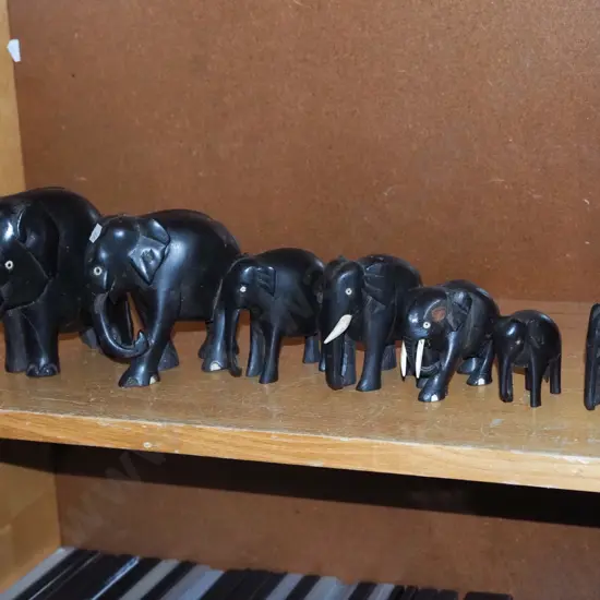 herd of ebony elephants - missing tusks and damaged