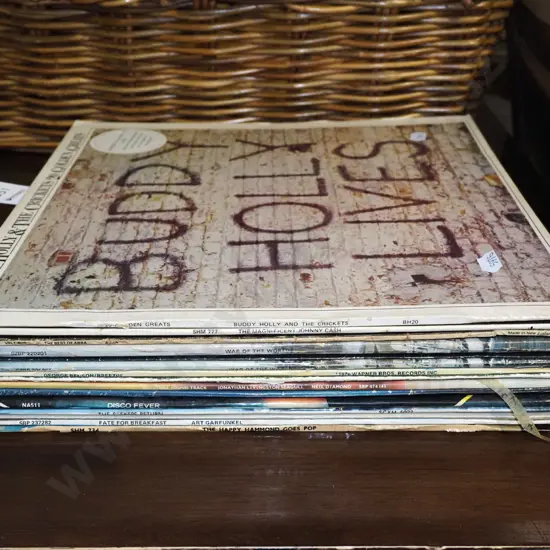 stack of LPs; Buddy Holly, Johnny Cash etc