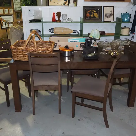 solid wood dark stained dining table with 6 matching brown ladder back chairs