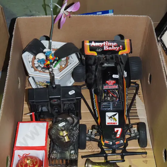 box; radio control car, faux orchids, brass vases etc