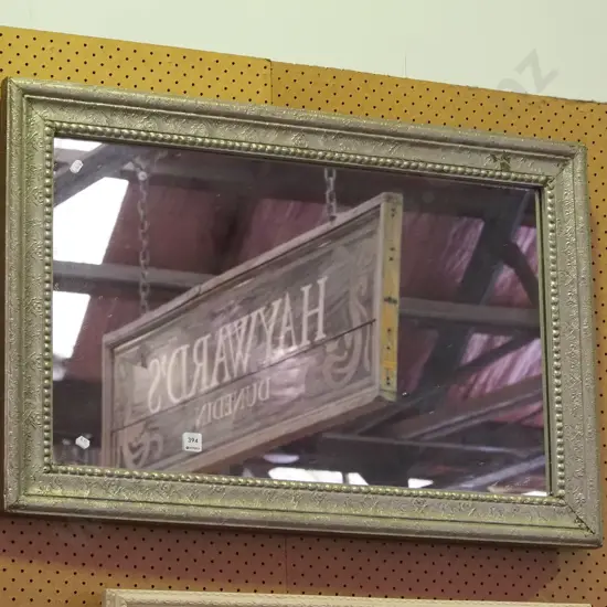 pressed metal framed wall mirror