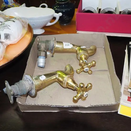pair of heavy brass taps