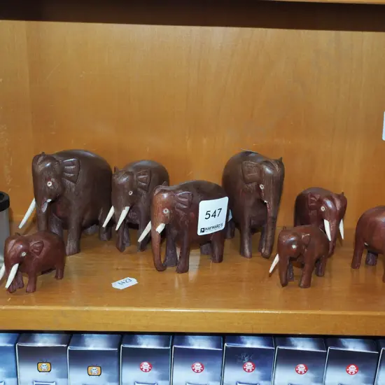 assorted carved wooden elephants