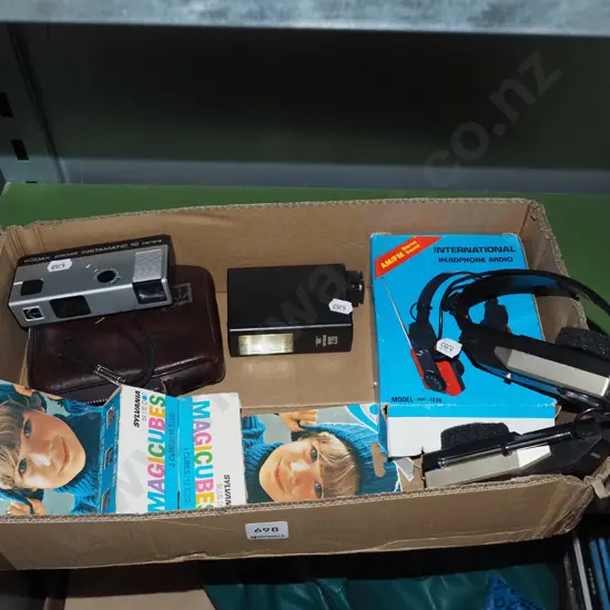 box; 1980s radio headphones, instamatic camera etc