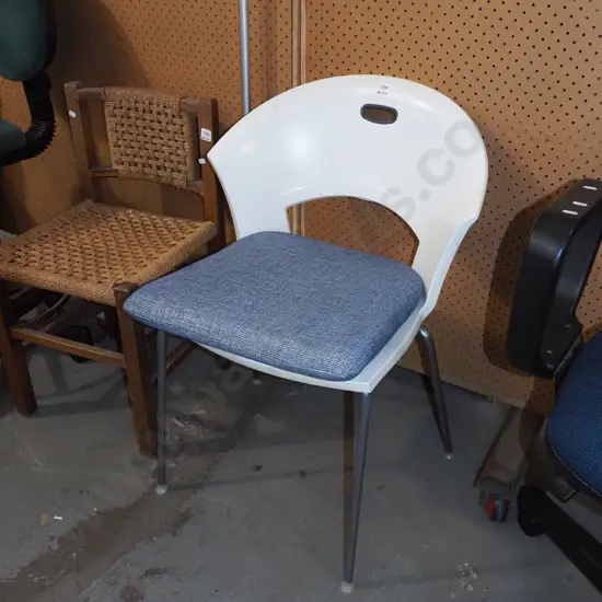 white plastic chair with cushion