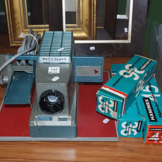 Bell and Howell slide projector with additional cartridges