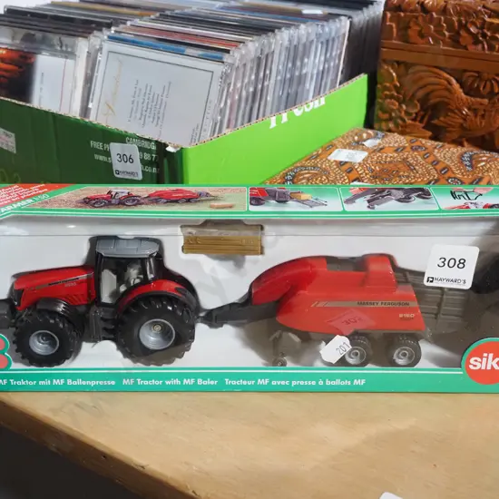 cased as new tractor and hay bailer