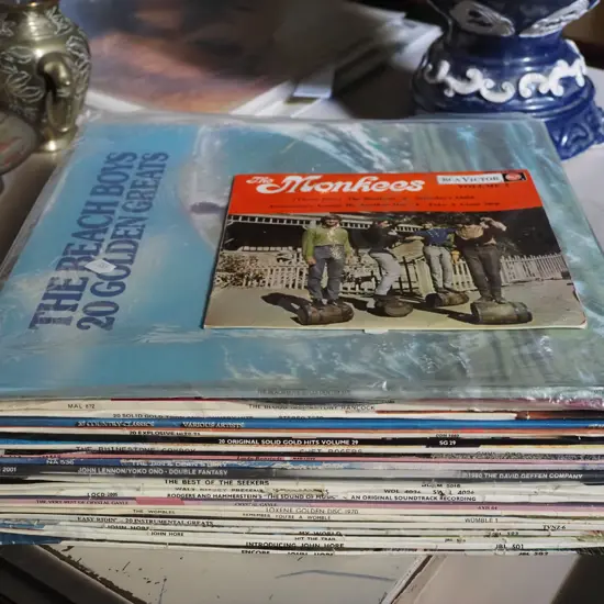 stack of assorted LPs and a Monkees 7"