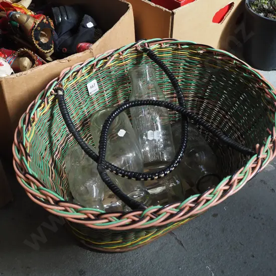 woven plastic basket, various vintage bottles