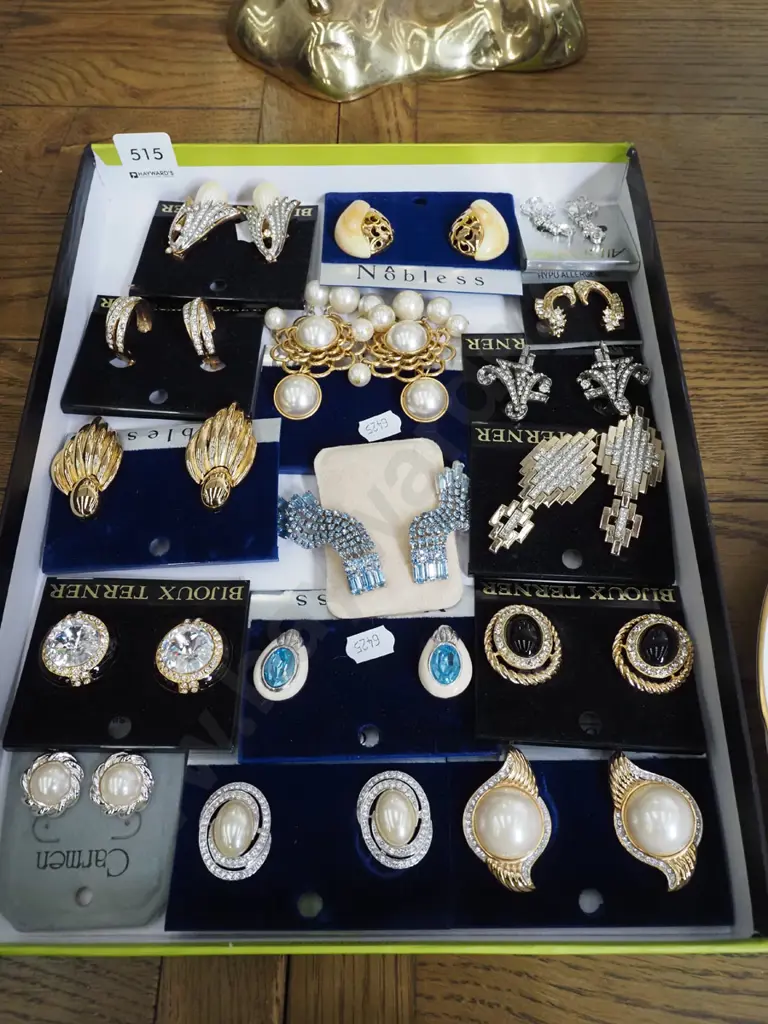 tray of various clip on earrings Image 1++