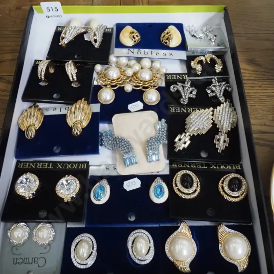 tray of various clip on earrings