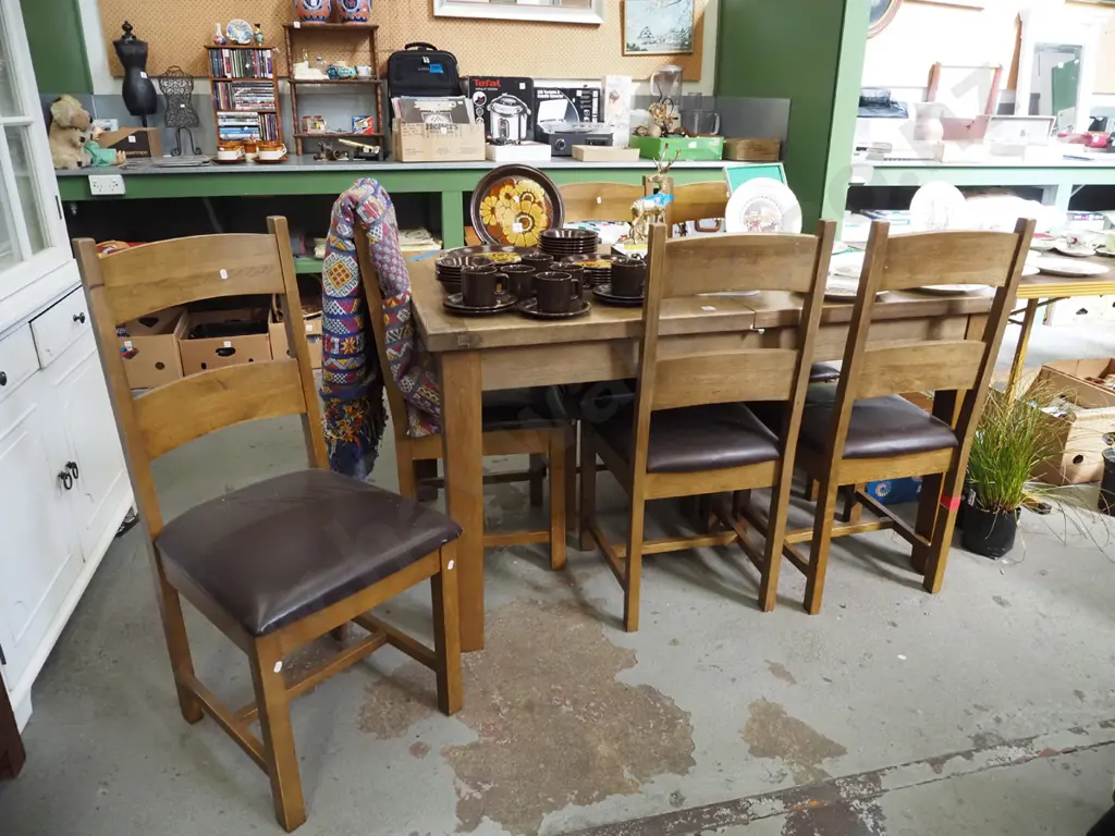 oak extending dining table with 6 matching brown vinyl chairs Closed H790 W1400 D900 Image 1++