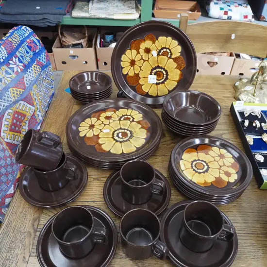 assorted brown floral dinner items; plates, bowls etc