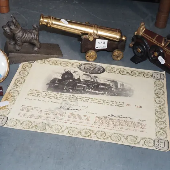 brass cannon, corkscrew, share certificate etc