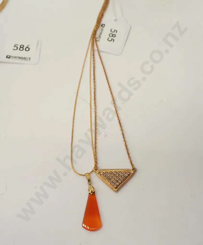 2x gold plated pendants on chains Image 1++