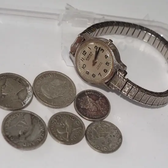 various coins, wristwatch