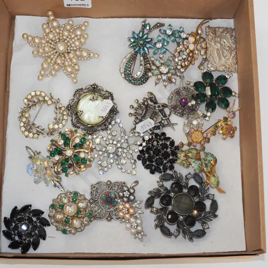 box of costume brooches