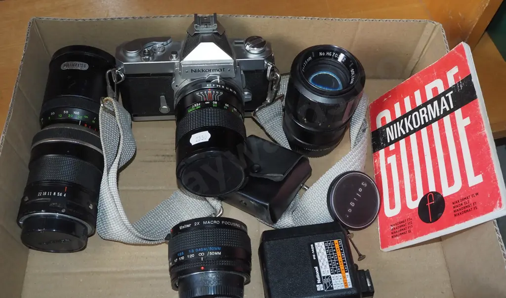 box; Nikkormat SLR 35mm film camera with flash and lenses etc. Image 1++
