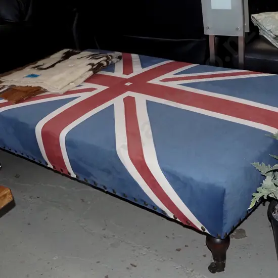 large Union Jack upholstered ottoman on turned legs with brass casters H390 W1400 D800