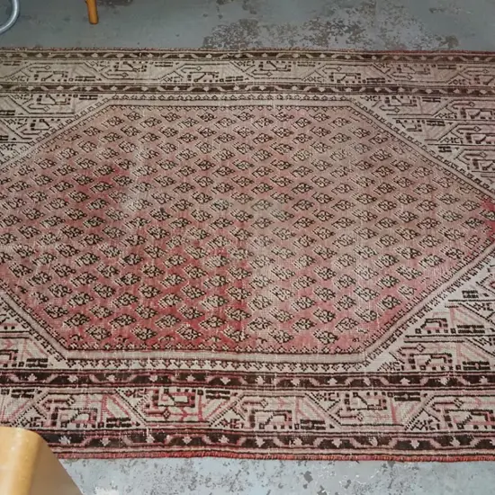 woven well worn and faded floor mat L2000 W1220