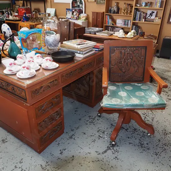 heavily carved hardwood Chinese desk with 6 drawers, 1 door, matching chair - repair to chair