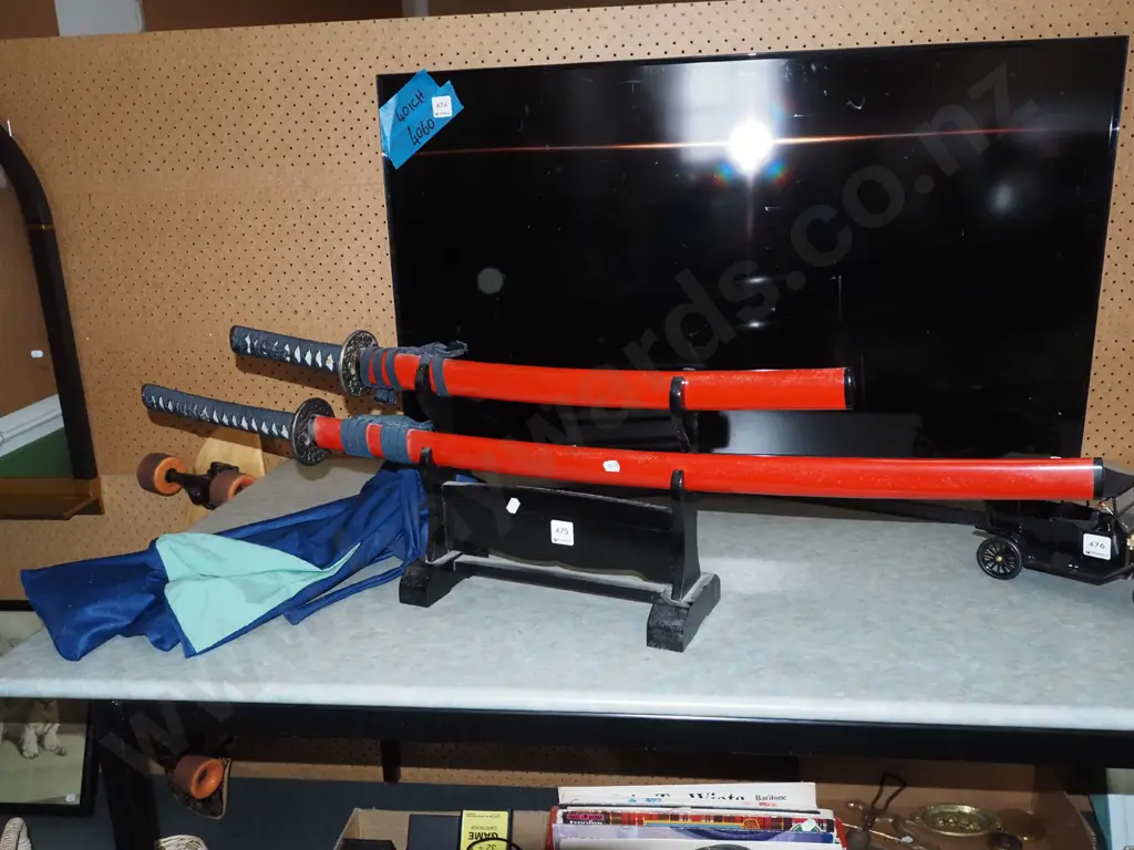 2x Japanese decorative swords with stands and blue fabric protective bags Image 1++